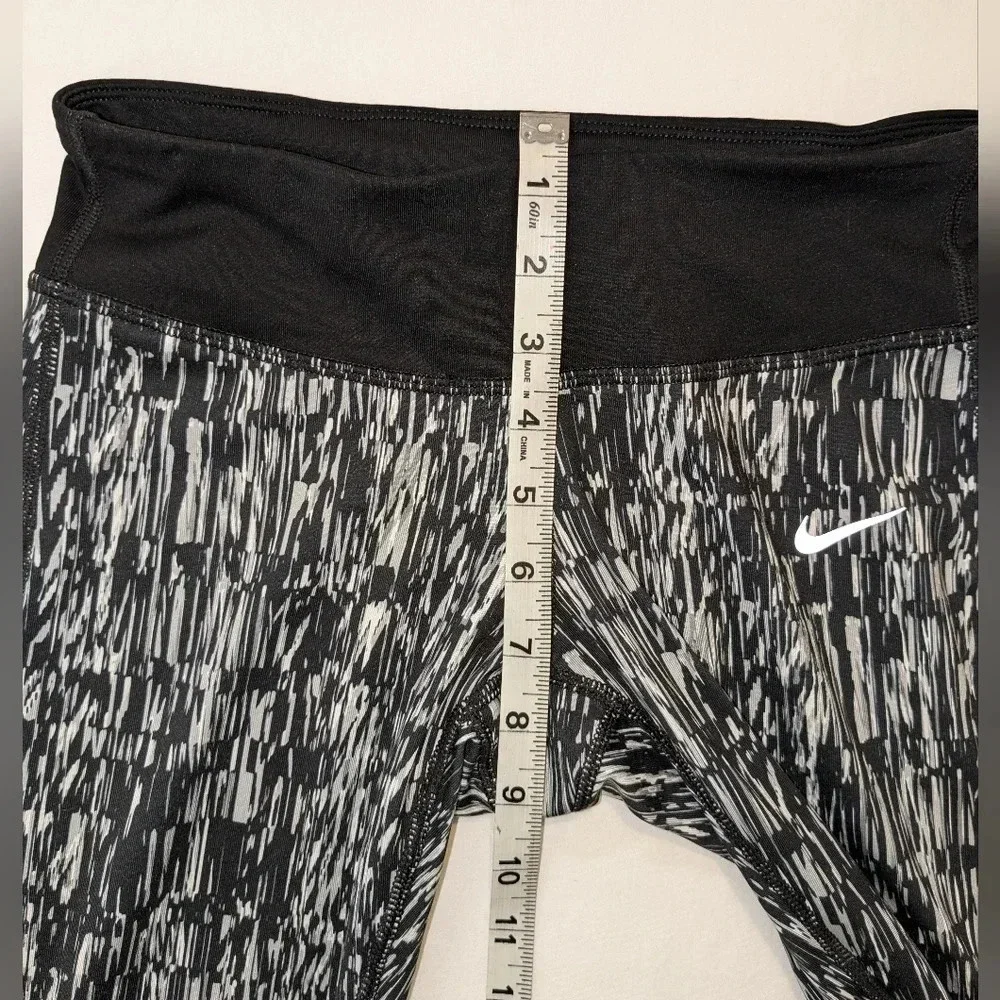 Nike women's graphic DRI-FIT tight running Capri leggings, size XS , black/white
